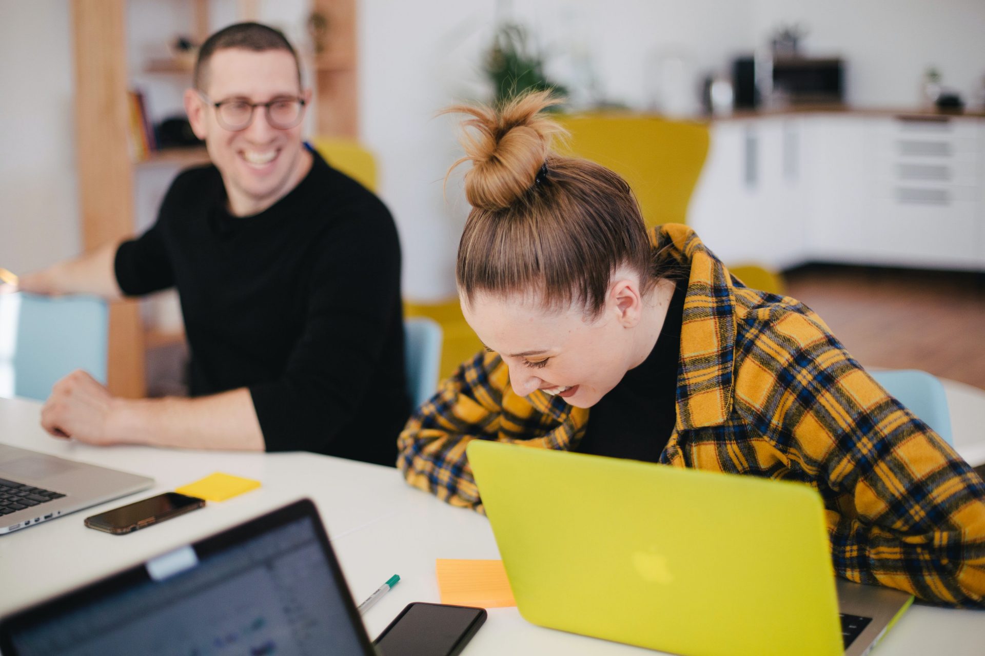 A man and woman getting fun at the office